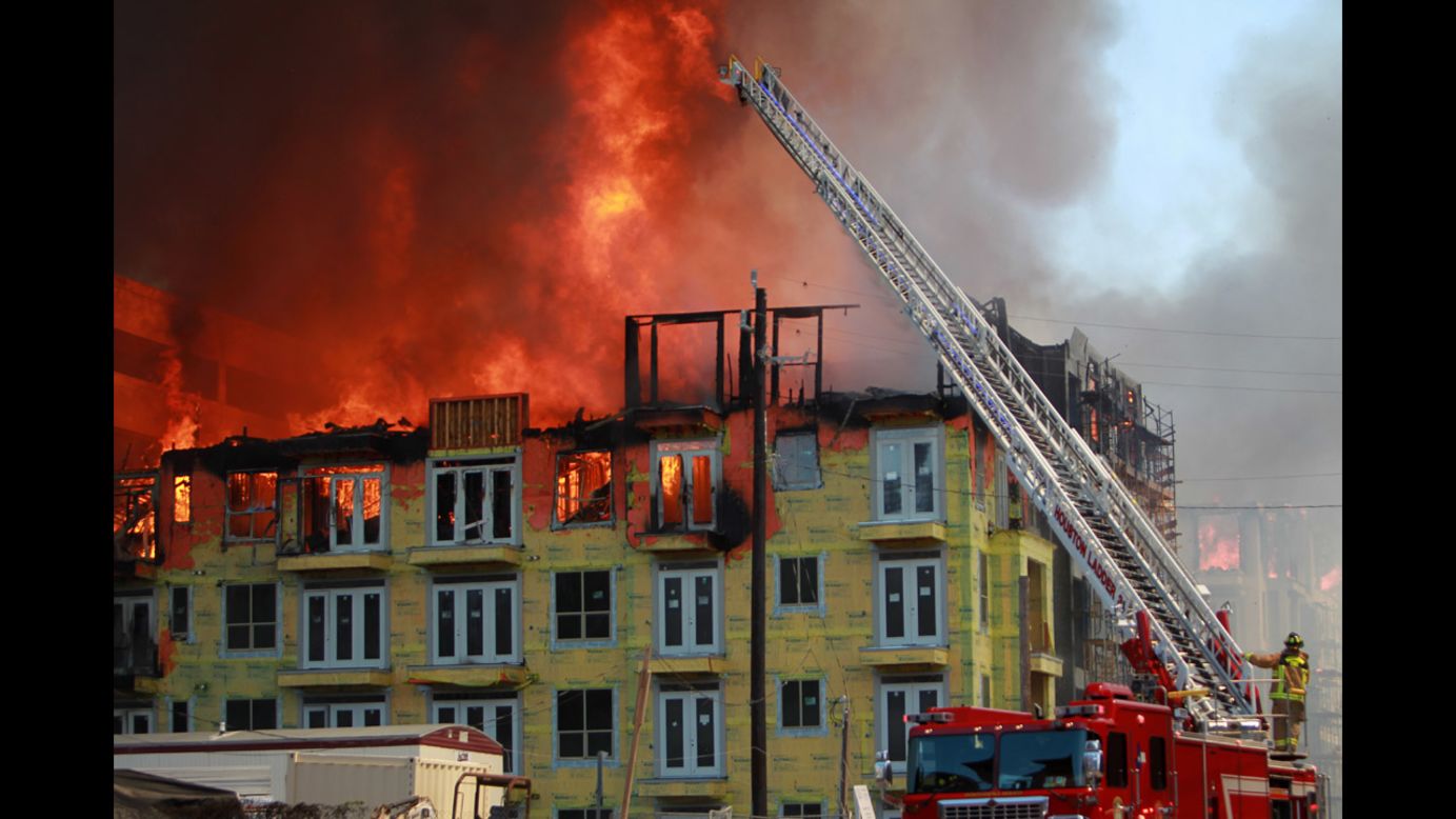 Firefighters try to extinguish a five-alarm blaze at a construction site in Houston on Tuesday, March 25. <a href="http://ac360.blogs.cnn.com/2014/03/26/inside-the-houston-construction-inferno-rescue/">A dramatic rescue</a> was caught on video.