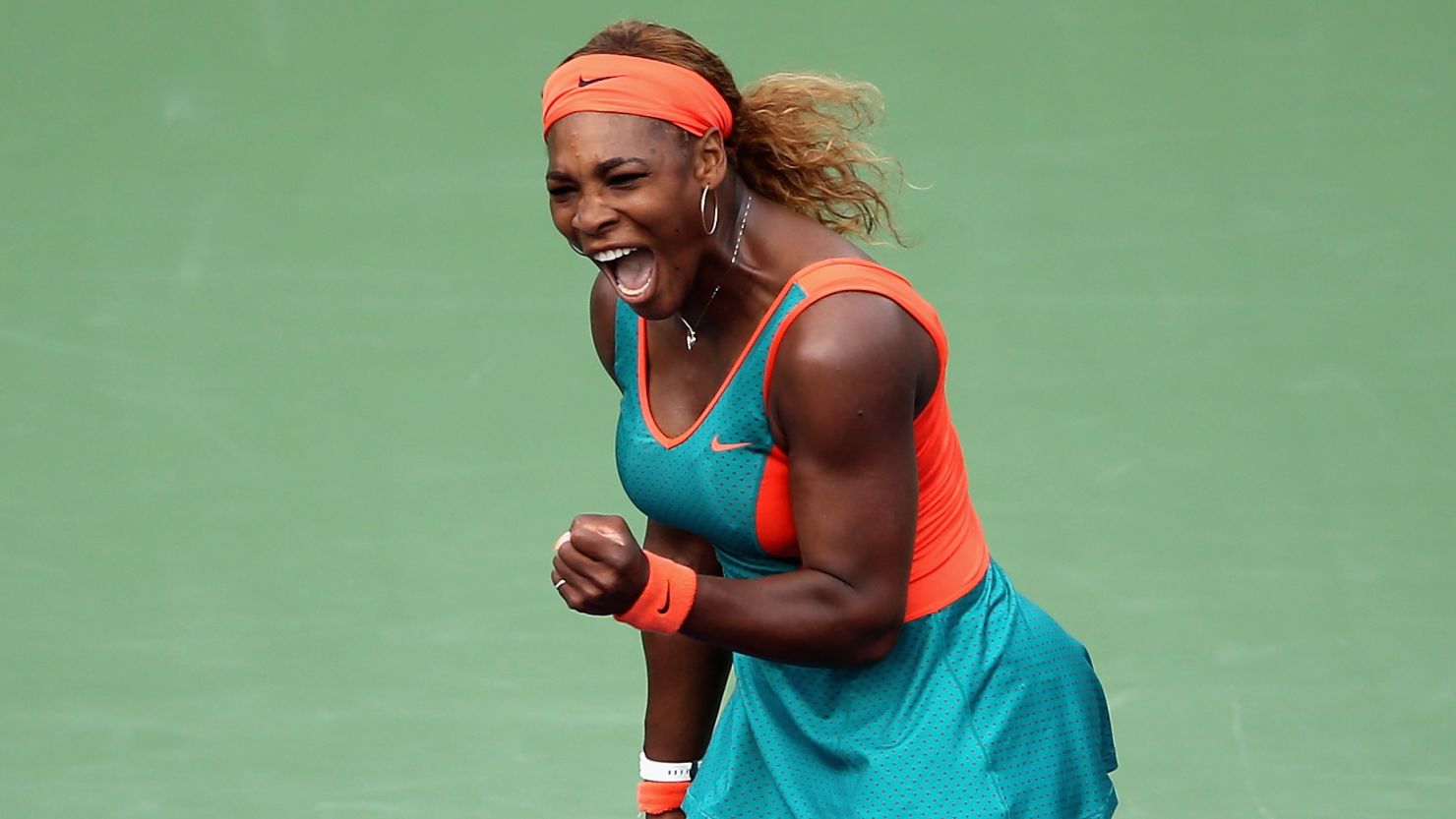 Serena Williams punches the air in delight during her semifinal match-up with Russia's Maria Sharapova.
