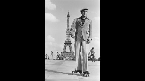 Gene Kelly wears roller skates in Paris while shooting scenes for "That's Entertainment, Part II."