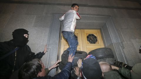 Members of the Right Sector group block the Ukrainian parliament building in Kiev on Thursday, March 27. Activists called for Interior Minister Arsen Avakov to step down after the <a href="http://www.cnn.com/2014/03/26/world/europe/ukraine-right-wing/index.html">recent killing of radical nationalist leader Oleksandr Muzychko</a>, who died during a police operation to detain him. Muzychko and the Right Sector are credited with playing a lead role in the protests that toppled Ukrainian President Victor Yanukovych.