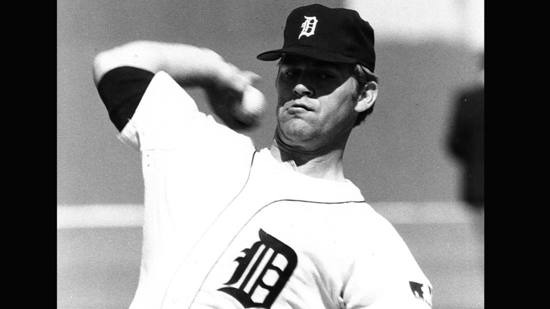 Former Detroit Tigers pitcher Denny McLain tips his hat to the