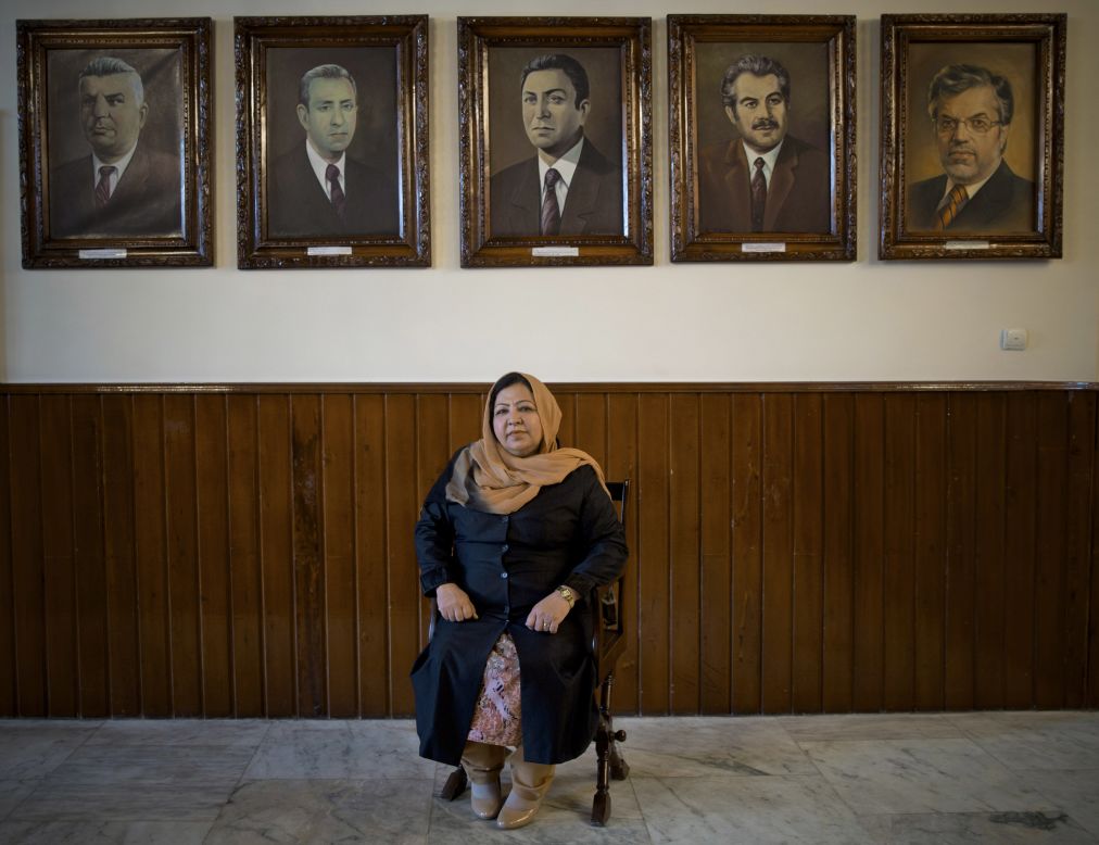MARCH 28 - KABUL, AFGHANISTAN: Afghan lawmaker Habiba Sadat from Helmand province poses under pictures of former presidents of Afghanistan's parliament. During the Taliban rule, women rarely left their homes. In this year's presidential election, three leading candidates have chosen women as their running mates.