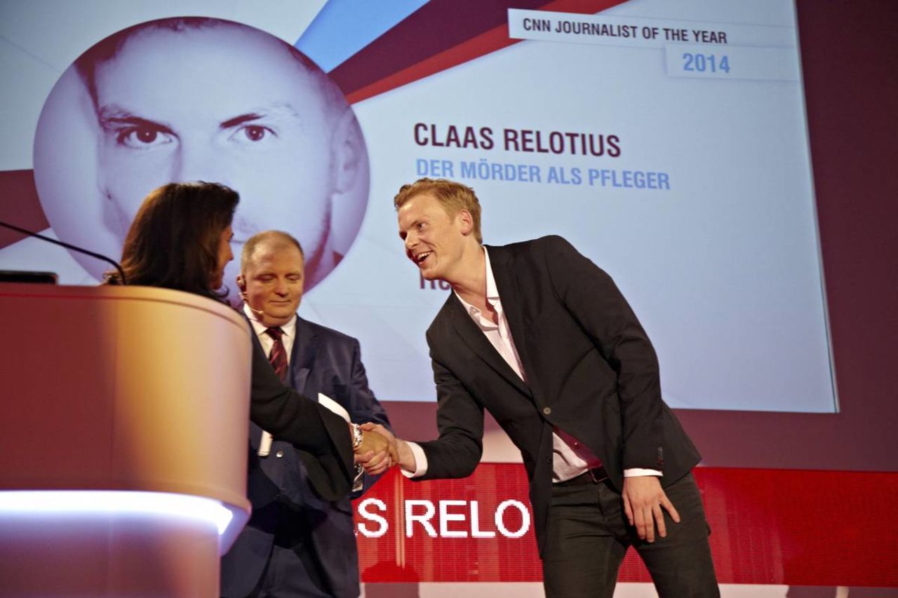 Claas Relotius is awarded the CNN Journalist of the Year 2014 accolade by Parisa Khosravi, senior vice president for CNN Worldwide.