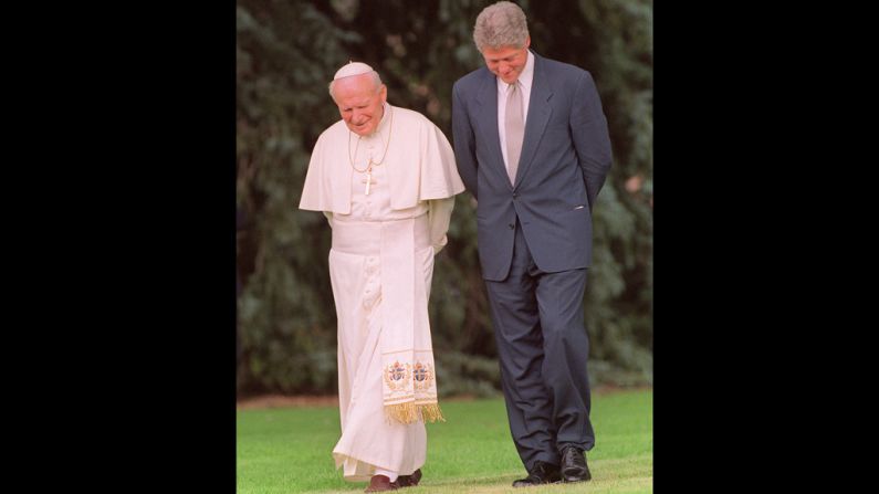 August 12, 1993, Pope John Paul II and President Bill Clinton walk the grounds of Regis University in Denver.
