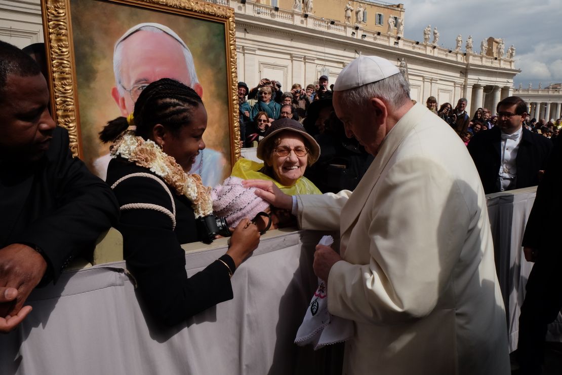 Pope Francis pats Jersey Vargas on the head and blesses her during her trip to the Vatican in March 2014.