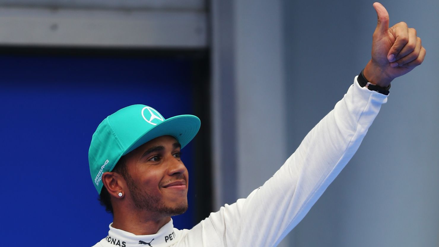 Lewis Hamilton was all smiles after finishing first in qualifying for the Malaysian Grand Prix. 