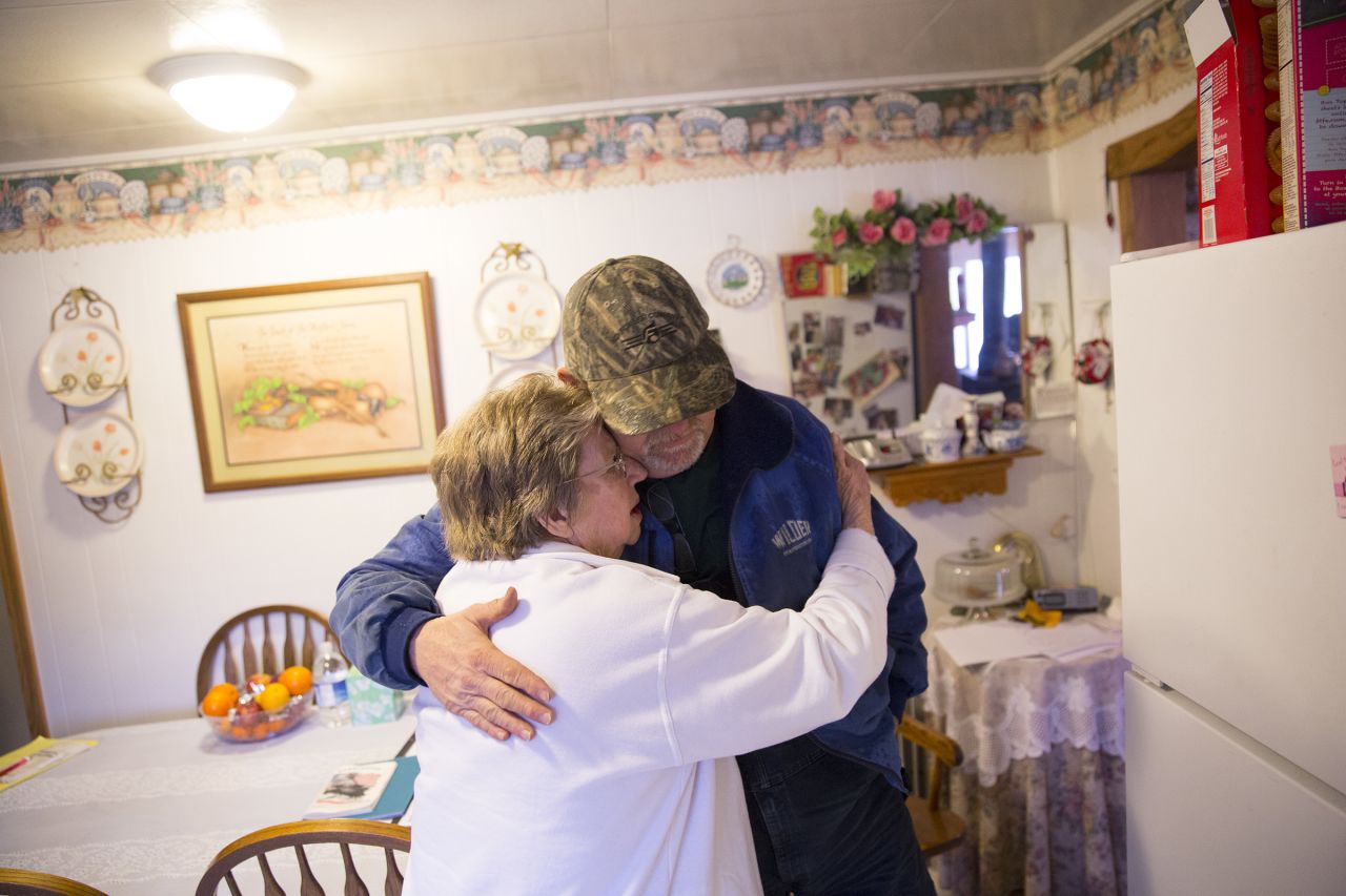 Mike Cabe hugs his mother, Janet, at her house in Darrington. Janet, 82, prepared food for firefighters and other volunteers.