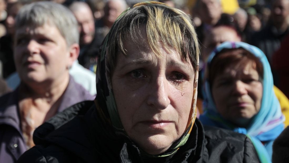 A woman cries Sunday, March 30, during a gathering to honor those who were killed during protests in Kiev's Independence Square.