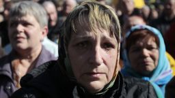 A woman cries during a gathering to honor those who were killed during protests in Kiev's Independence Square on Sunday, March 30.