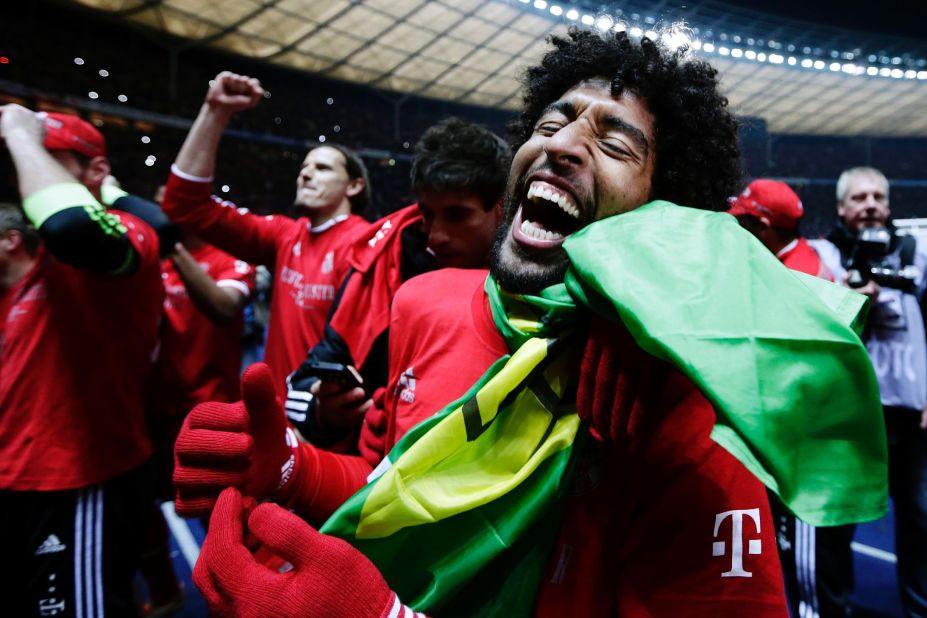 Dante of Munich celebrates after the Bundesliga match between and Hertha BSC and FC Bayern Muenchen at Olympiastadion on March 25, 2014 in Berlin, Germany.
