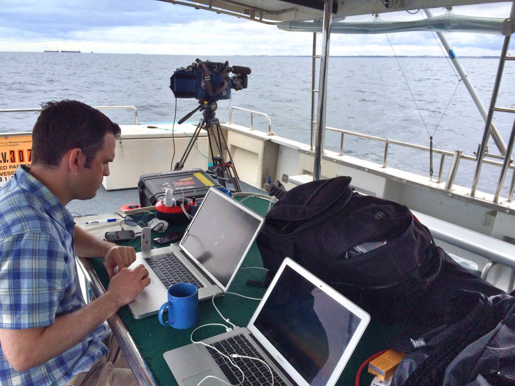 CNN senior producer David Molko prepares for one of dozens of live shots from the aft deck of the Thunder.