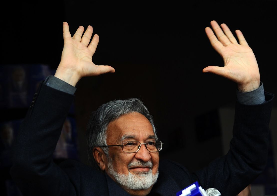 "Establishment candidate" Zalmai Rassoul, waves to supporters at a rally in the northwestern city of Herat