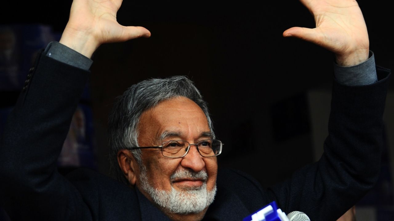 "Establishment candidate" Zalmai Rassoul, waves to supporters at a rally in the northwestern city of Herat