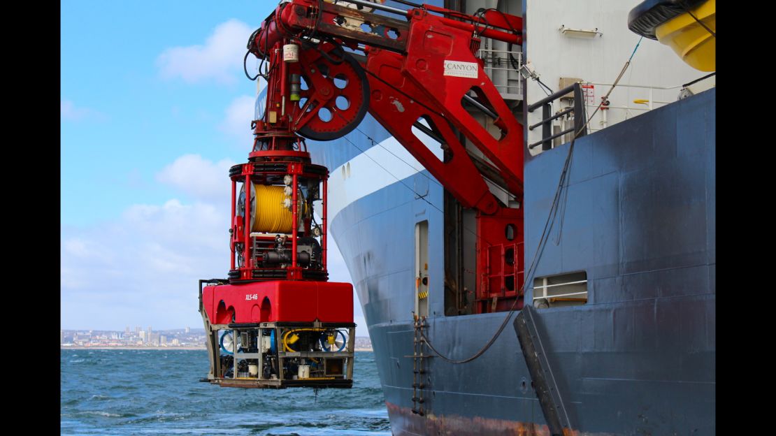 A remotely operated vehicle is lowered into the waters of the North Sea on March 23.
