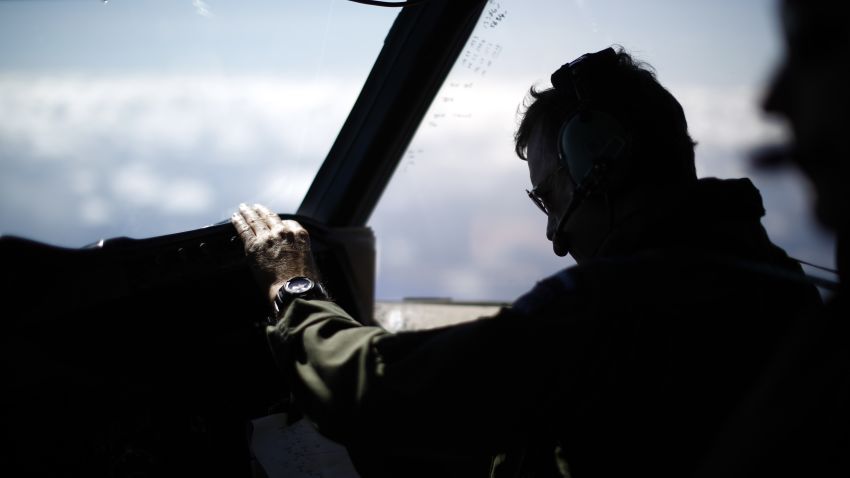 Wing Commander Rob Shearer is pictured on the flight deck of a Royal New Zealand Air Force P-3K2 Orion aircraft searching for missing Malaysian Airlines flight MH370 on March 29, 2014 over the southern Indian Ocean.