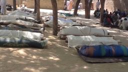 Dead bodies are laid out for burial, in the village of Konduga, in northeastern Nigeria, on February 12, 2014 after a gruesome attack by Boko Haram Islamists killed 39 people.