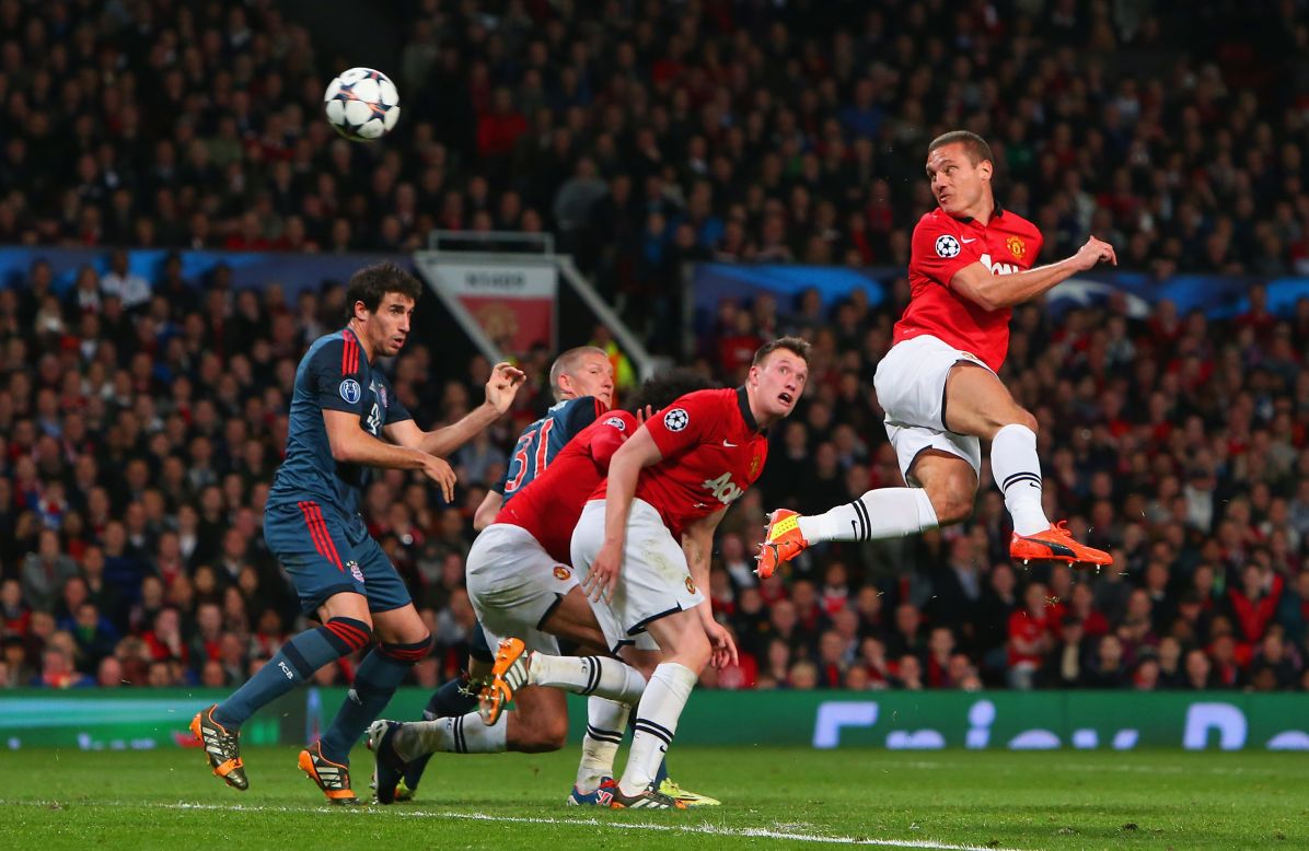 Nemanja Vidic of Manchester United heads in the first goal during the UEFA Champions League quarterfinal first leg between Manchester United and Bayern Munchen at Old Trafford.