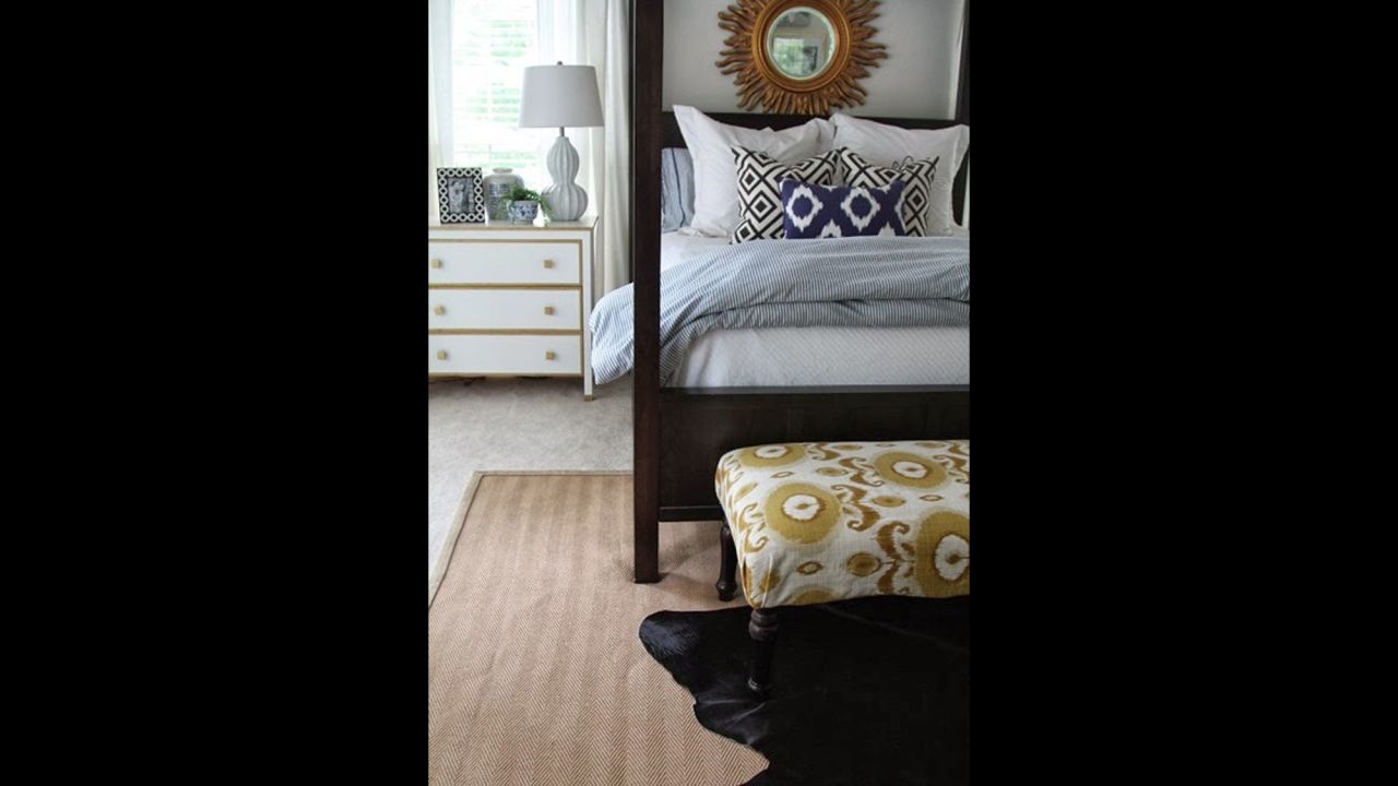 Clark layers rugs and blue bedding for a rich mix of texture and color in her master bedroom.