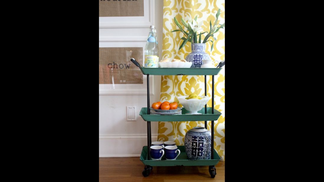 A small cart in the kitchen adds a pretty injection of Clark's favorite blue.