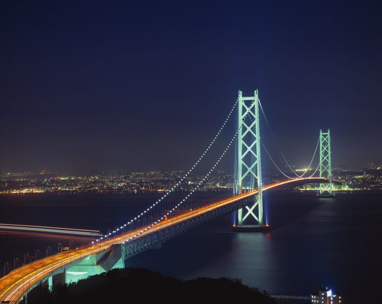 Japan's Akashi-Kaikyo Bridge spans 2.43 miles and connects the city of Kobe to Awaji Island. Also called the Pearl Bridge, because it is said to resemble a beautiful string of pearls, the bridge is lit up in different seasonal or festive colors throughout the year. It is built to withstand earthquakes (a 7.2 magnitude earthquake hit in 1995), consistently strong tidal currents (9 knots), and wind gusts up to 179 mph.