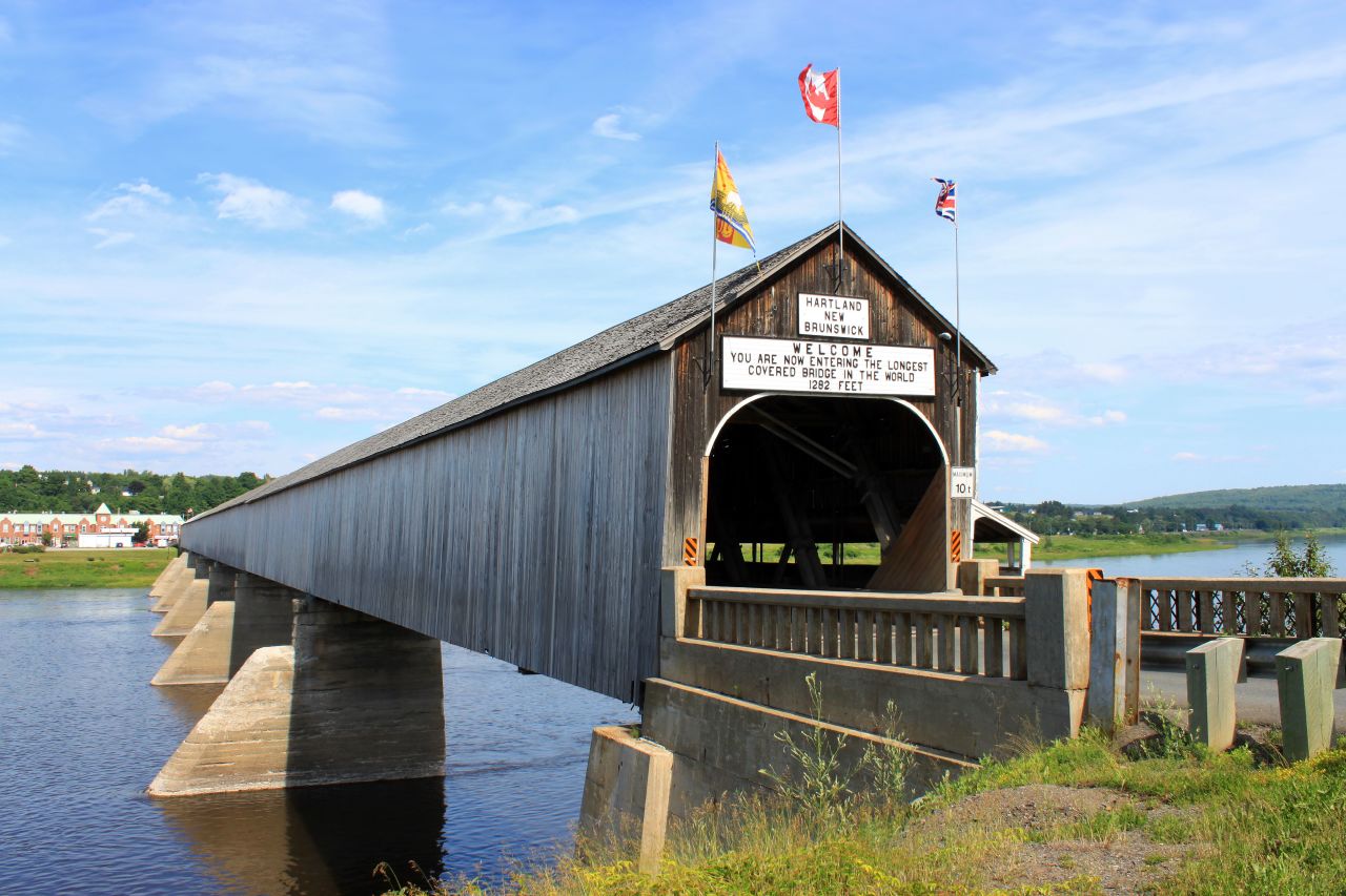 The longest covered bridge is the Hartland Bridge in New Brunswick, Canada, a National Historic Site of Canada.