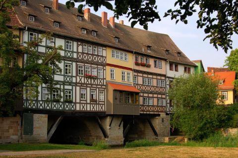Krämerbrücke -- "Merchant's Bridge" --located in Erfurt, Germany, is a stone arch bridge dating back to 1325. The ground floors of most houses have been converted to antique and craft shops while the upper floors are still used as private residences.  