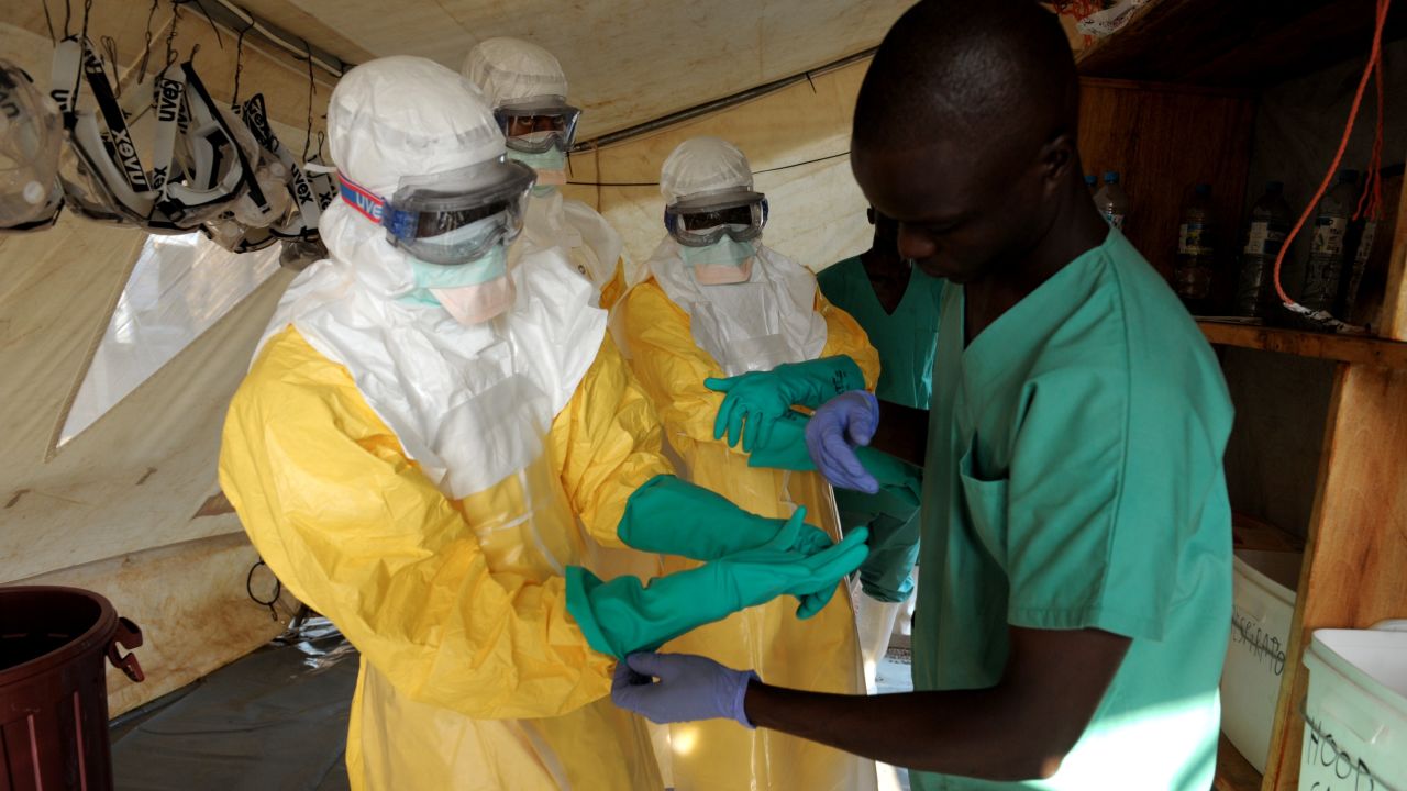 Health specialists work in an isolation ward for patients at the Doctors Without Borders facility in Guékedou, southern Guinea. 