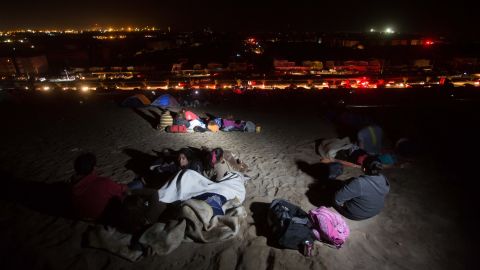 People stay on a beach in Arica, Chile, after the earthquake struck. The quake generated tsunami waves of more than 6 feet on the coast of Pisagua, according to the Pacific Tsunami Watch Center. Iquique saw 7-foot waves.