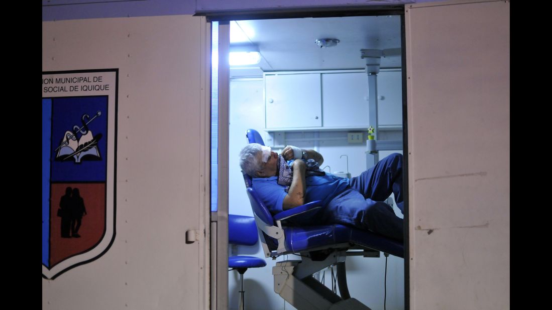 A man waits for medical treatment at an emergency center in Iquique on April 2.