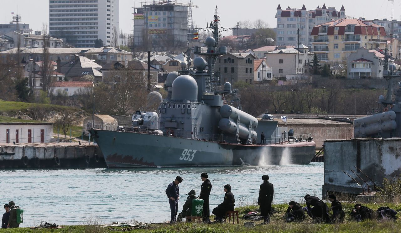 Russian soldiers prepare for diving training in front of a Tarantul-III class missile boat Tuesday, April 1, in Sevastopol.