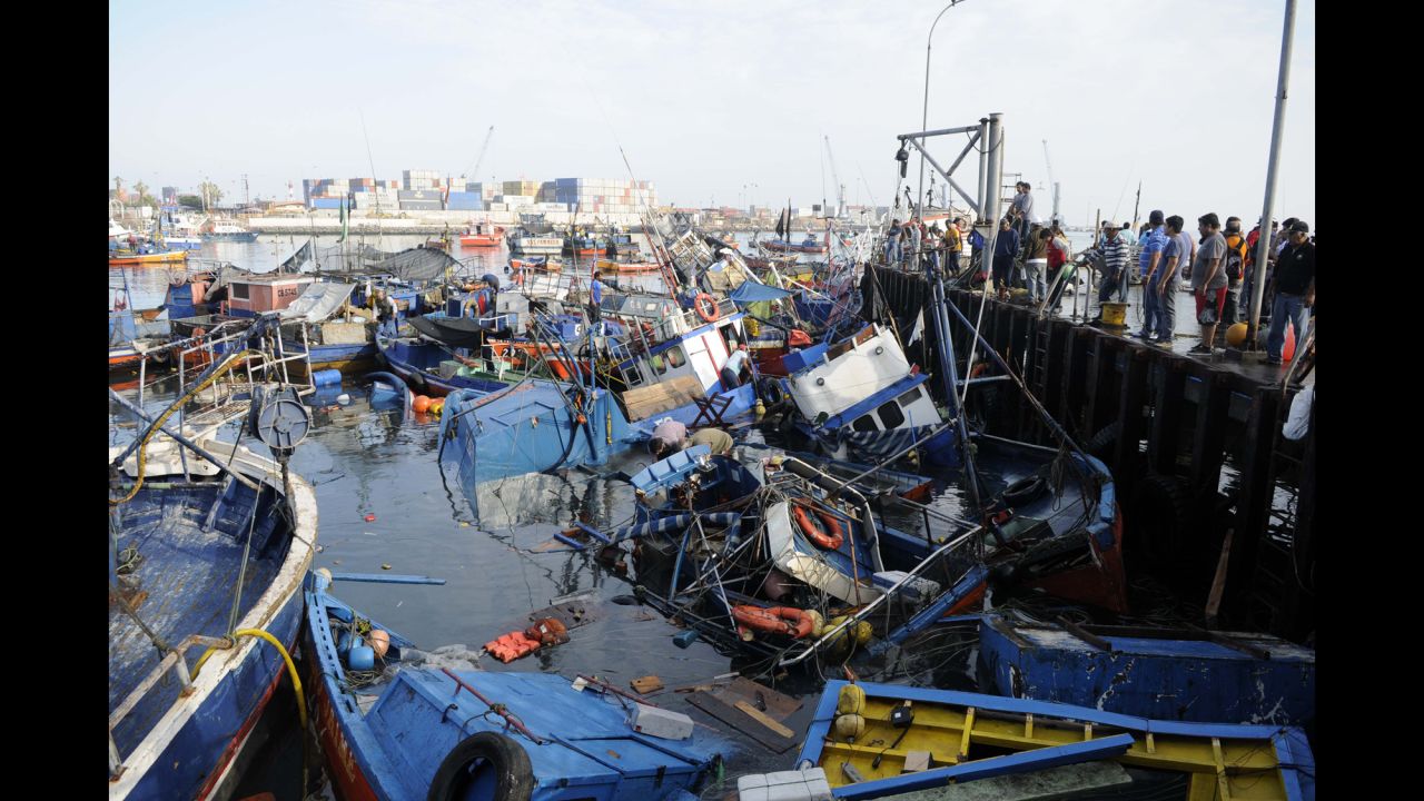 Fishing boats washed ashore by a tsunami sit in the waters of Iquique on April 2. 