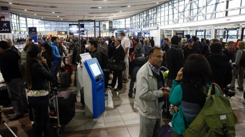 People wait at the Arturo Merino Benitez Airport in Santiago, Chile, on April 2 as flights are canceled because of the earthquake.