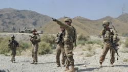 US soldiers gather after a clash between Taliban and Afghan security forces in Torkham on September 2, 2013.