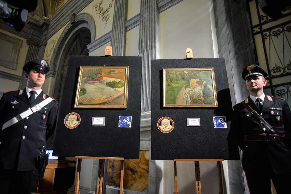 Italy's Culture Ministry unveils two paintings by the French artists Paul Gauguin and Pierre Bonnard on April 2, 2014. The paintings were stolen from a family house in London in 1970, abandoned on a train and then later sold at a lost-property auction, where a factory worker paid 45,000 Italian lira for them -- roughly equivalent to 22 euros ($30) at the time.