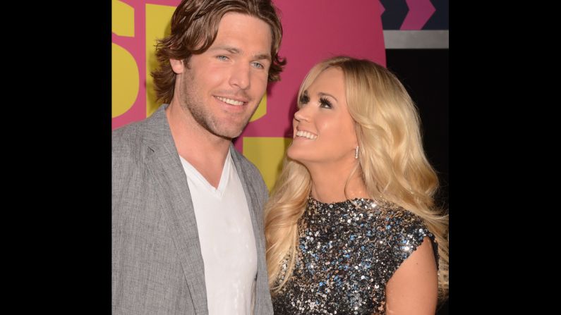 <strong>Mike Fisher </strong>and<strong> Carrie Underwood:</strong> As one of music's top-selling artists, Carrie Underwood is far more than a hockey player's wife -- but that doesn't mean she doesn't <a href="http://marquee.blogs.cnn.com/2011/01/07/carrie-underwood-loves-being-a-hockey-wife/?iref=allsearch" target="_blank">enjoy every moment of it</a>. The "American Idol" champ married Canadian hockey star Mike Fisher in 2010 after a little more than a year of dating. "You make my life better in every way!" Underwood gushed of her athlete love in the liner notes for her 2009 album, "Play On." "I thank God for you every day." 