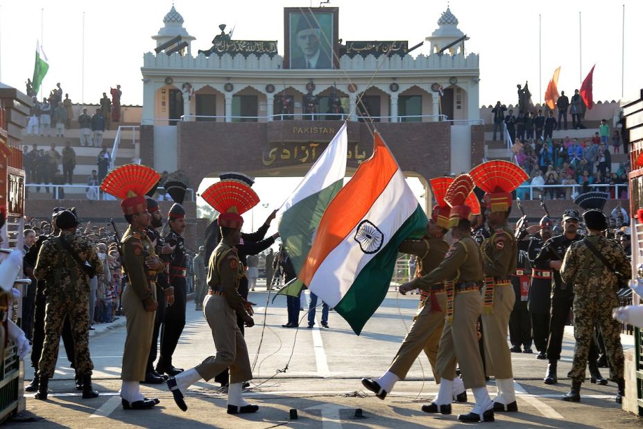 Pakistani Rangers (in black) and Indian Border Security Force personnel (in brown) perform the daily retreat ceremony on the India-Pakistan Border at Wagah. 