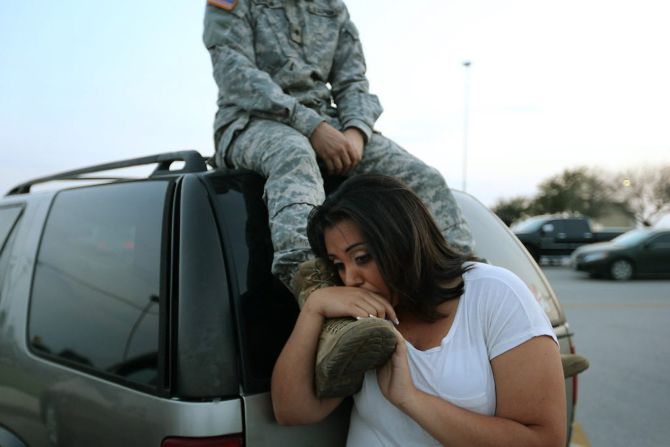 Luci Hamlin and her husband, Spc. Timothy Hamlin, wait to get back to their home at Fort Hood after a shooting at the Texas Army post on Wednesday, April 2. Multiple people were killed and others injured when a shooter opened fire, a senior military official and law enforcement official told CNN. The officials said the suspected shooter was among the dead.