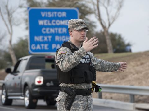 Military police direct traffic outside Fort Hood.