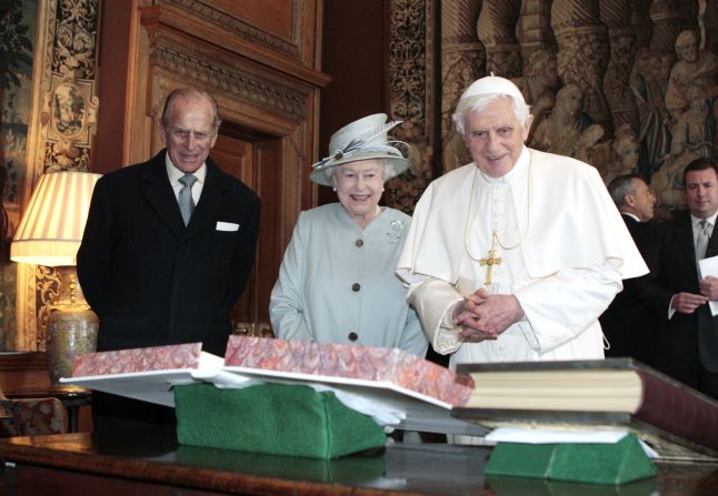 The Queen, accompanied by her husband, Prince Philip, exchanges gifts with Pope Benedict XVI in Edinburgh, Scotland, in September 2010.