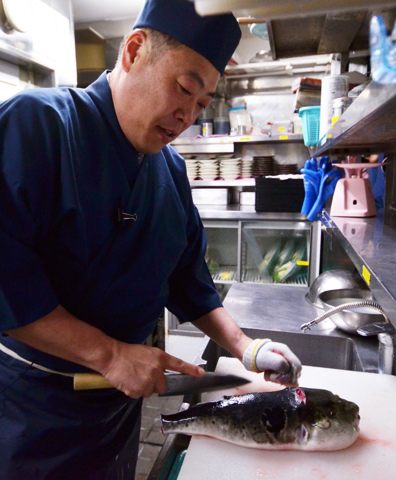 Chef Shigekazu Suzuki slices a puffer fish, known as fugu in Japan, to remove toxic internal organs at his Tokyo restaurant Torafugu-tei. Often served in sashimi form, fugu is famed for its subtle but flavorful taste.