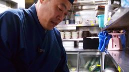 Japanese chef Shigekazu Suzuki slices up a pufferfish, known as fugu in Japan, to remove toxic internal organs at his Tokyo restaurant 'Torafugu-tei.' 