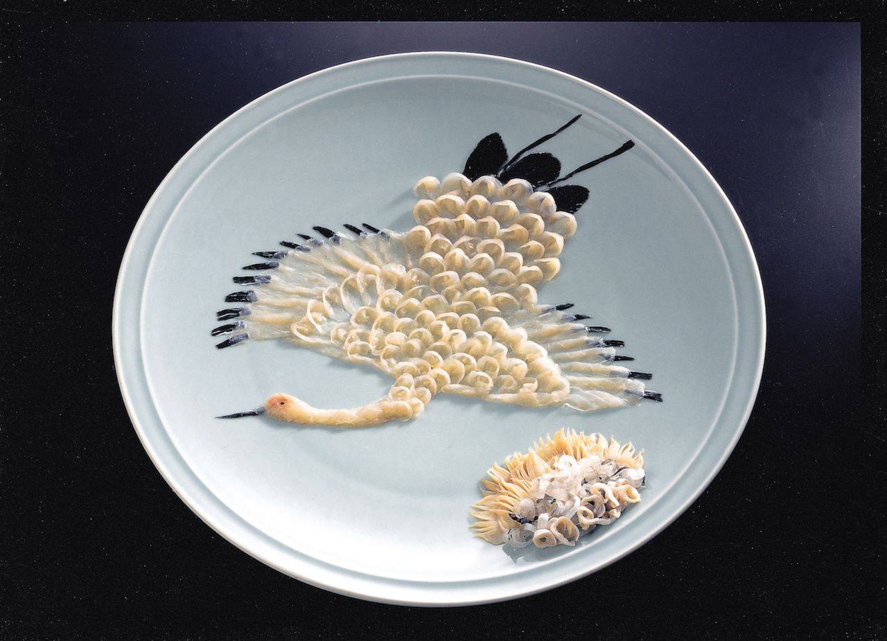 "Fugu is served in transparent paper-thin strips on painted porcelain plates," says Toshiharu Hata, who runs the largest fugu wholesale business in Shimonoseki, Japan. "Master chefs cut them into chrysanthemum petals, Mount Fuji or animals like peacocks, turtles and butterflies."  