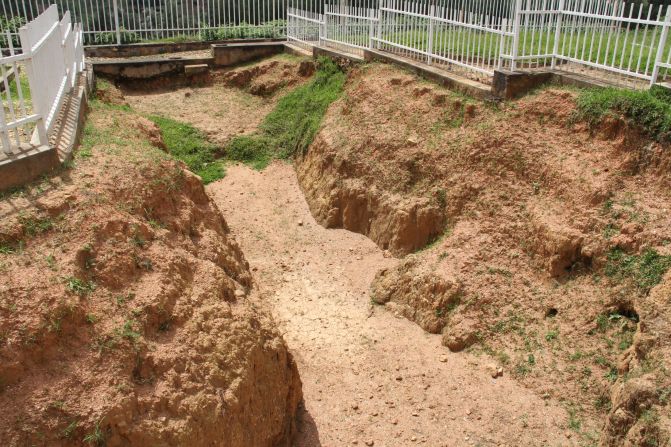 A preserved mass grave at Murambi Genocide Memorial serves as a stark reminder of the atrocities of genocide and the oft-quoted pledge, "Never again."