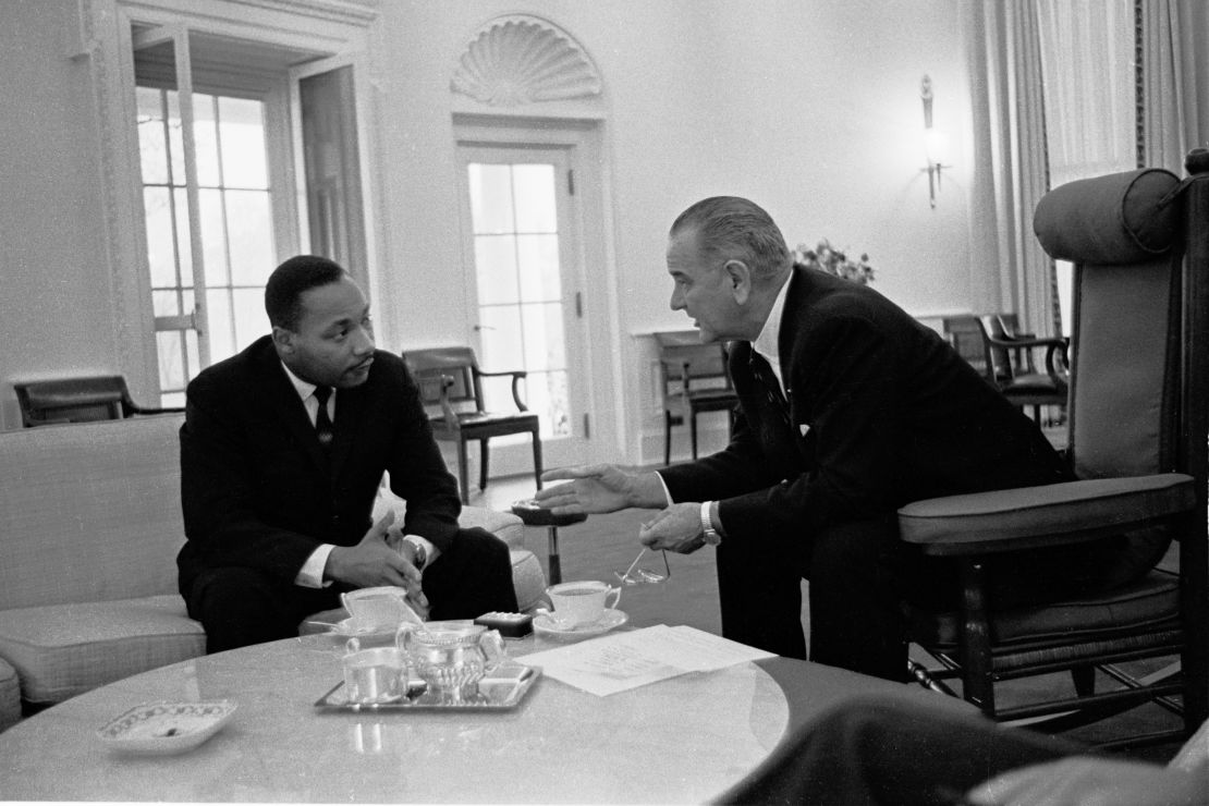 Martin Luther King, Jr., left, speaks with President Lyndon B. Johnson in the Oval Office on December 3, 1963.