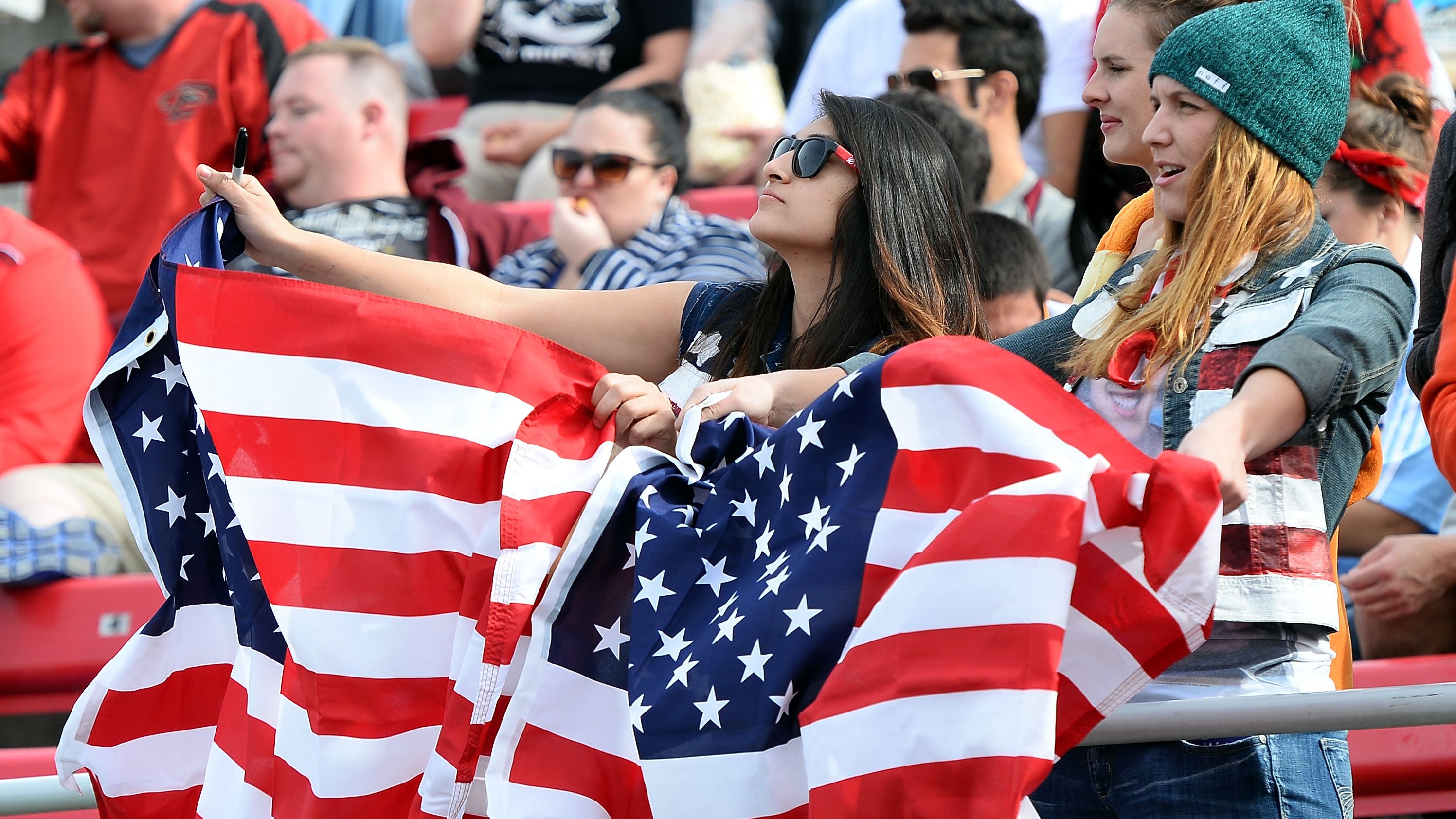 Two fans cheer on the American team during the recent Las Vegas leg of the HSBC Sevens World Series.