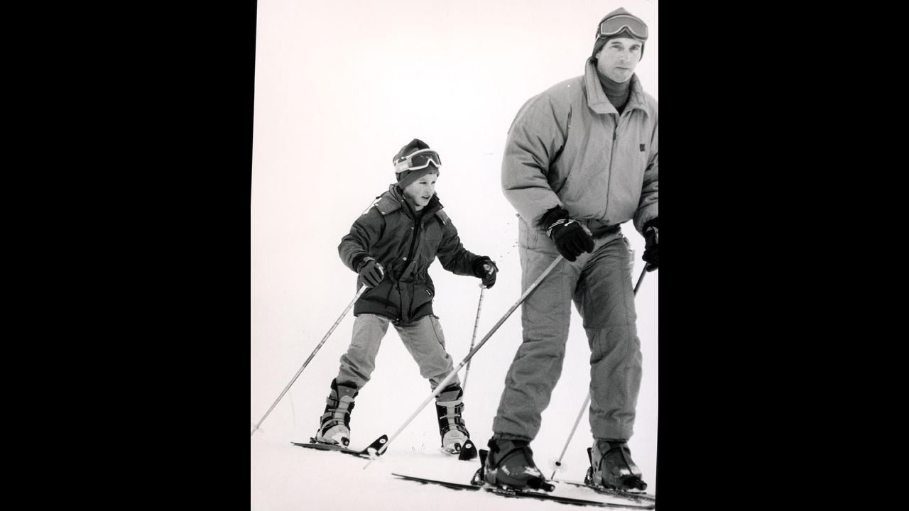 Capt. Mark Phillips, then-husband of Princess Anne, skies with  his son, Peter, in Morzine, France, in January 1986. 