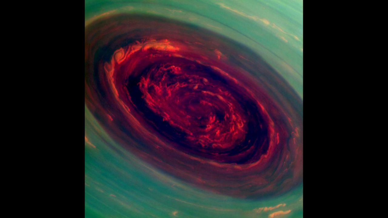 This false-color image of Saturn's north polar storm looks like a giant red rose surrounded by green foliage. Measurements indicate the storm's eye is a staggering 1,250 miles across with cloud swirling as fast as 330 mph.