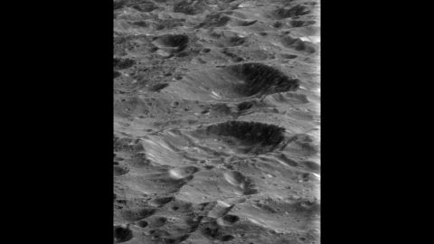 Rhea's surface is pockmarked with craters from billions of years of impacts. The moon is Saturn's second-largest, with a diameter of 949 miles.