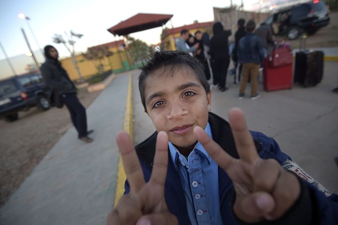 APRIL 4 - MELILLA, SPAIN: A Syrian refugee shows the victory sign prior to his departure from the Centre for Temporary Stay of Immigrants to make his way to mainland Spain. The U.N. said the<a href="http://edition.cnn.com/2014/04/03/world/meast/lebanon-syrian-refugees/index.html?hpt=imi_c1"> total number of registered Syrian refugees is 2.58 million</a>.
