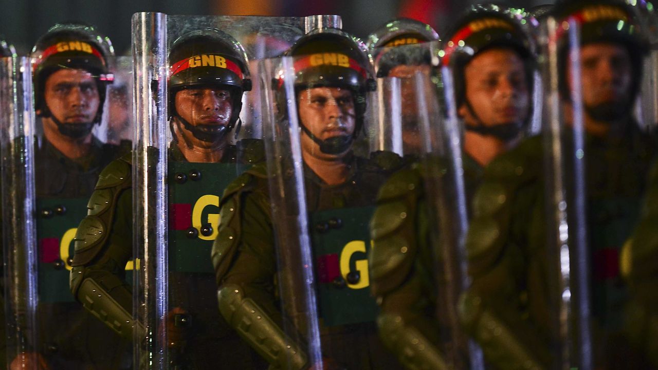 National Guard soldiers in riot gear after the installation of President Nicolas Maduro in Caracas on March 19, 2013. 